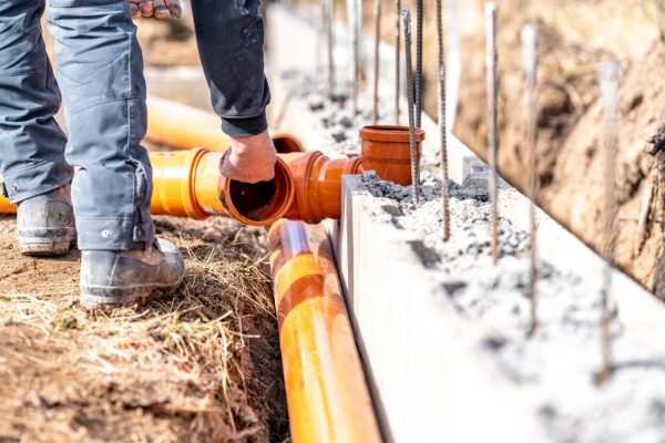Installation,Of,A,Sewage,Plastic,Pipe,During,The,Construction,Of Installation,Of,A,Sewage,Plastic,Pipe,During,The,Construction,Of